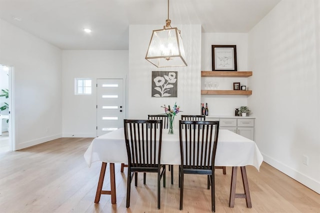 11616 NW 106th St, Yukon, OK 73099 - dining room with light wood-style floors, baseboards, and a chandelier