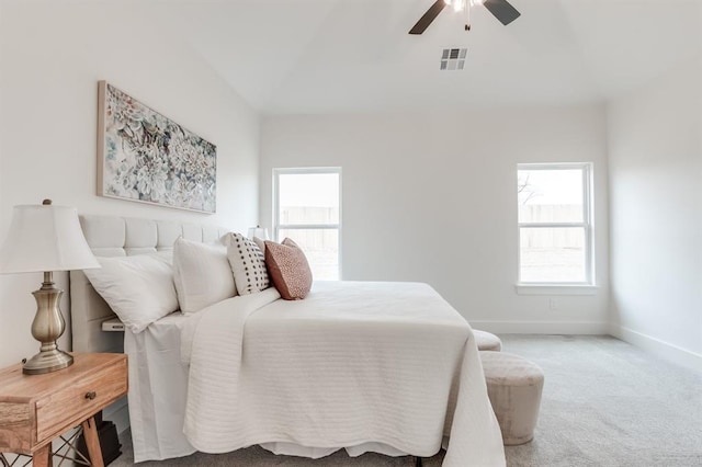 11616 NW 106th St, Yukon, OK 73099 - carpeted bedroom with multiple windows, baseboards, lofted ceiling, and a ceiling fan