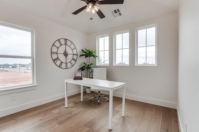 11616 NW 106th St, Yukon, OK 73099 - home office featuring ceiling fan, baseboards, and light wood-style floors