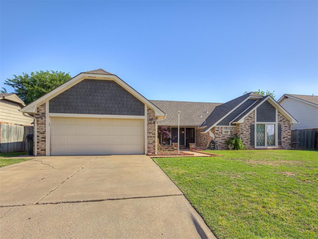 7225 Warriner Way, Oklahoma City, OK 73162 - view of front of property with driveway, a garage, and roof with shingles