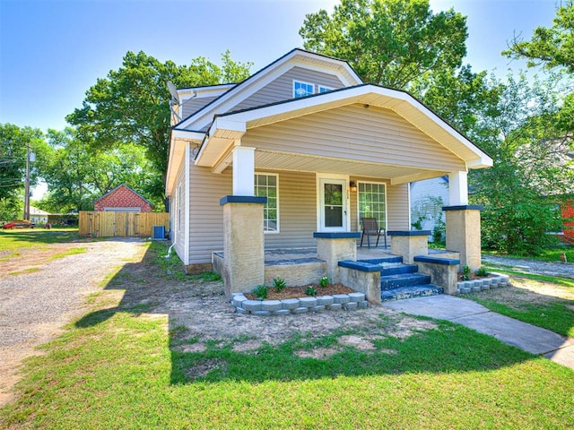 908 N Barta Ave, Prague, OK 74864 - view of front facade with a porch, dirt driveway, and cooling unit