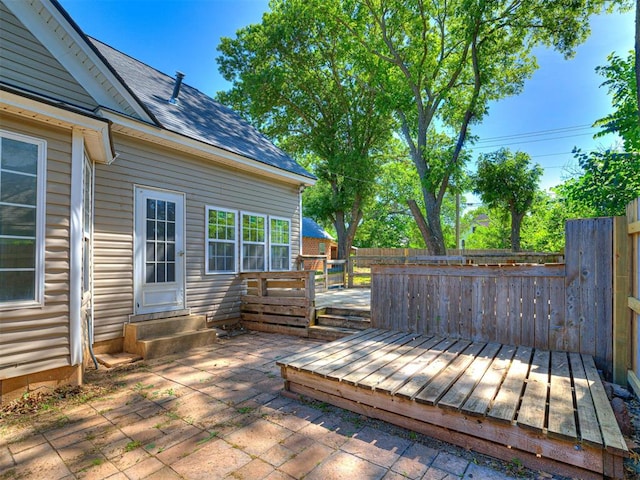 908 N Barta Ave, Prague, OK 74864 - deck with a patio area, a fenced backyard, and entry steps