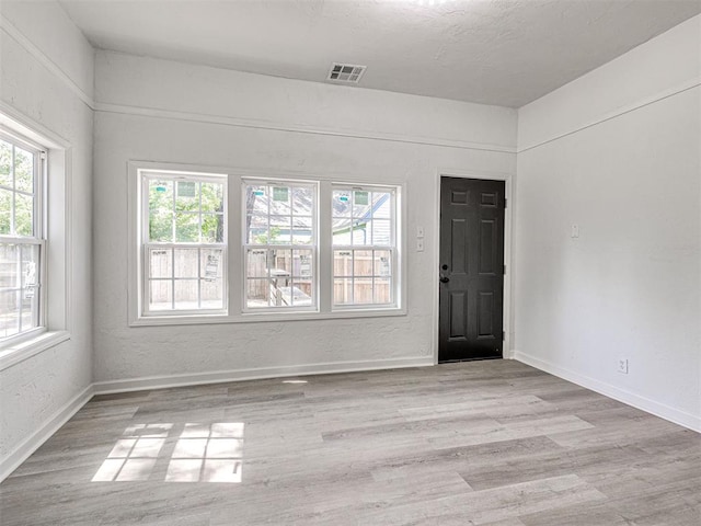 908 N Barta Ave, Prague, OK 74864 - unfurnished room with wood finished floors and baseboards