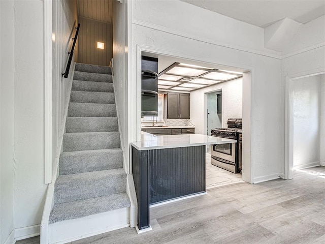 908 N Barta Ave, Prague, OK 74864 - stairs with wood finished floors and baseboards