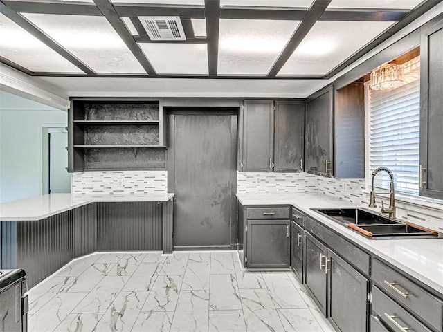908 N Barta Ave, Prague, OK 74864 - kitchen with a sink, open shelves, light marble finish flooring, tasteful backsplash, and light countertops