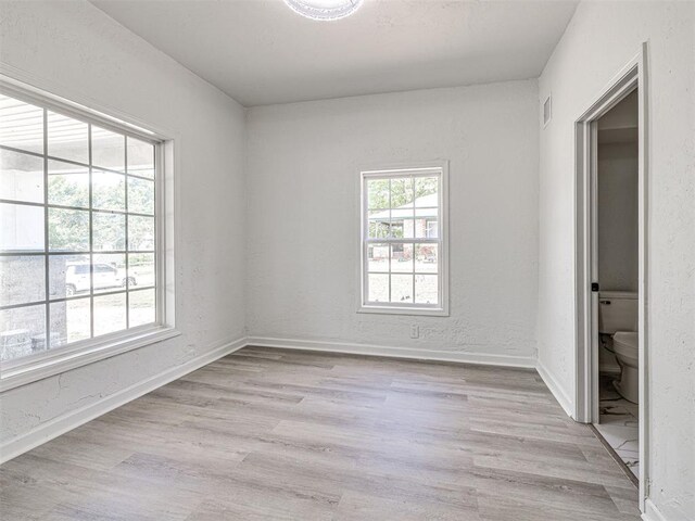 908 N Barta Ave, Prague, OK 74864 - unfurnished bedroom with light wood-style floors and baseboards