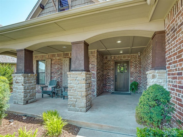 4300 High Range Ln, Edmond, OK 73034 - property entrance with covered porch and brick siding