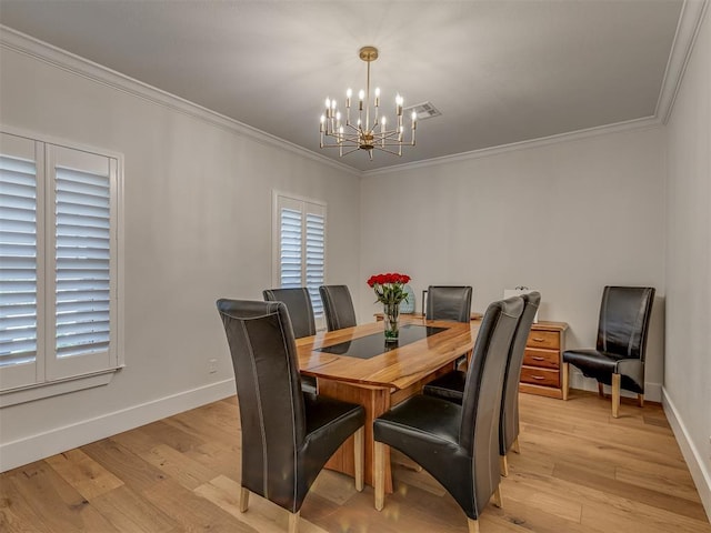 4300 High Range Ln, Edmond, OK 73034 - dining area featuring a chandelier, crown molding, baseboards, and light wood finished floors