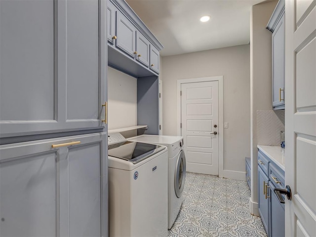 4300 High Range Ln, Edmond, OK 73034 - laundry room with washing machine and dryer, cabinet space, light tile patterned flooring, recessed lighting, and baseboards