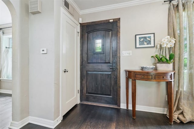 1109 Tedford Way, Nichols Hills, OK 73116 - foyer with baseboards, arched walkways, dark wood-type flooring, and ornamental molding