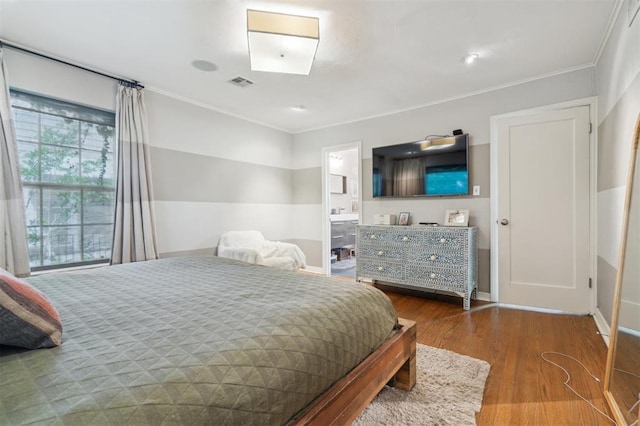 1109 Tedford Way, Nichols Hills, OK 73116 - bedroom with wood finished floors, ornamental molding, baseboards, and ensuite bath