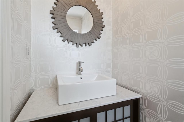 1109 Tedford Way, Nichols Hills, OK 73116 - bathroom featuring wallpapered walls and vanity