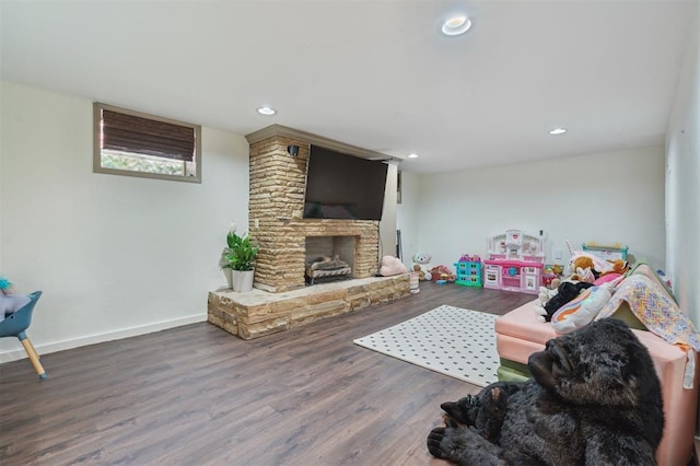 1109 Tedford Way, Nichols Hills, OK 73116 - living area featuring wood finished floors, recessed lighting, a stone fireplace, and baseboards