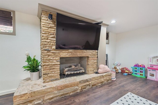 1109 Tedford Way, Nichols Hills, OK 73116 - living area with wood finished floors, a fireplace with raised hearth, and recessed lighting