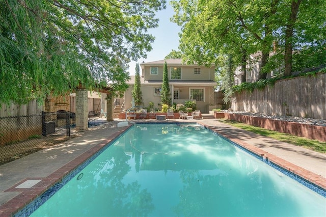 1109 Tedford Way, Nichols Hills, OK 73116 - view of swimming pool with a fenced backyard and stairs