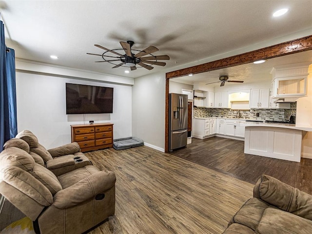 1515 S Reno Ave, El Reno, OK 73036 - living room featuring ceiling fan, baseboards, recessed lighting, and dark wood-style floors