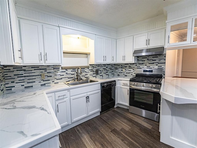 1515 S Reno Ave, El Reno, OK 73036 - kitchen with dishwasher, stainless steel range with gas cooktop, under cabinet range hood, a sink, and white cabinetry