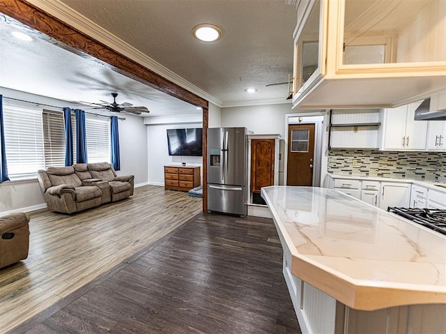 1515 S Reno Ave, El Reno, OK 73036 - kitchen with stainless steel fridge, baseboards, crown molding, open shelves, and a ceiling fan