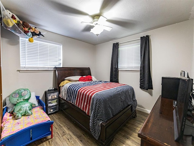 1515 S Reno Ave, El Reno, OK 73036 - bedroom featuring wood finished floors and a ceiling fan