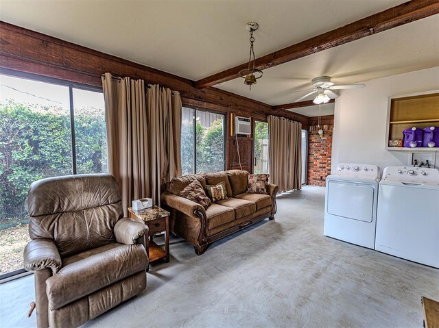 1515 S Reno Ave, El Reno, OK 73036 - living area with washing machine and dryer, carpet floors, a ceiling fan, beamed ceiling, and a wall mounted air conditioner