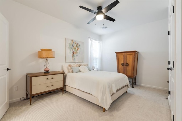 8421 NW 130th Ter, Oklahoma City, OK 73142 - bedroom with light carpet, baseboards, and a ceiling fan