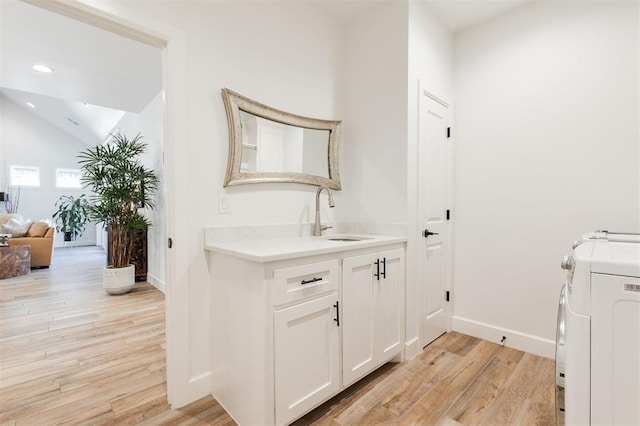 8421 NW 130th Ter, Oklahoma City, OK 73142 - washroom featuring baseboards, light wood-style floors, separate washer and dryer, and recessed lighting