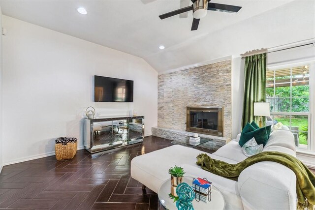 1712 De Vita Rd, Edmond, OK 73003 - living room featuring vaulted ceiling, a ceiling fan, a fireplace, baseboards, and recessed lighting