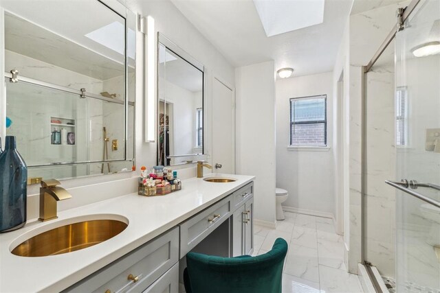 1712 De Vita Rd, Edmond, OK 73003 - bathroom with marble look tiles, a marble finish shower, toilet, and double vanity