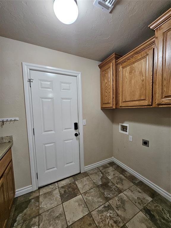 1801 Caribou St, Altus, OK 73521 - washroom featuring washer hookup, cabinet space, electric dryer hookup, and baseboards