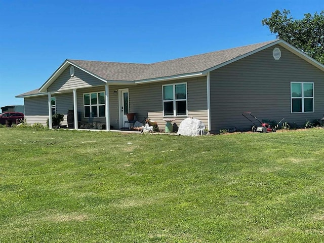 14452 Ns 3630th Rd, Sasakwa, OK 74867 - rear view of house featuring a lawn and a shingled roof