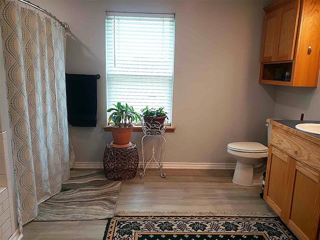 14452 Ns 3630th Rd, Sasakwa, OK 74867 - bathroom featuring wood finished floors, toilet, and baseboards
