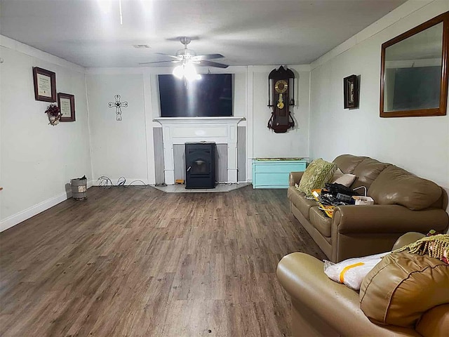 14452 Ns 3630th Rd, Sasakwa, OK 74867 - living room with wood finished floors, a ceiling fan, and a wood stove