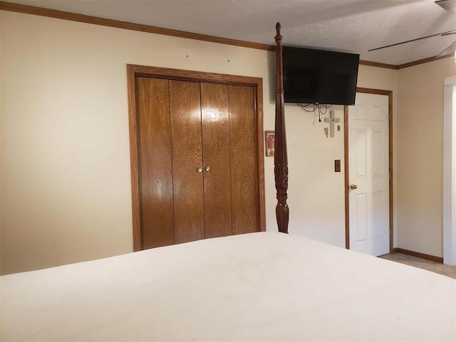 14452 Ns 3630th Rd, Sasakwa, OK 74867 - unfurnished bedroom with ornamental molding, baseboards, carpet floors, and a closet