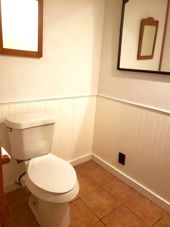 14452 Ns 3630th Rd, Sasakwa, OK 74867 - bathroom with wainscoting, tile patterned flooring, and toilet