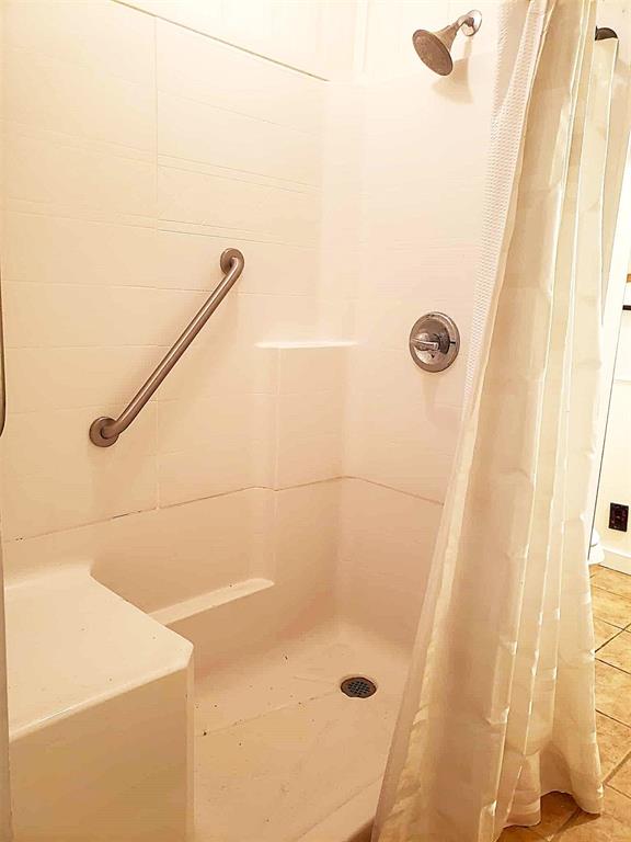 14452 Ns 3630th Rd, Sasakwa, OK 74867 - full bathroom featuring a shower stall and tile patterned floors