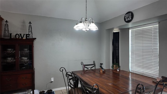 2338 Serenade Dr, Midwest City, OK 73130 - dining room with a chandelier, baseboards, and lofted ceiling