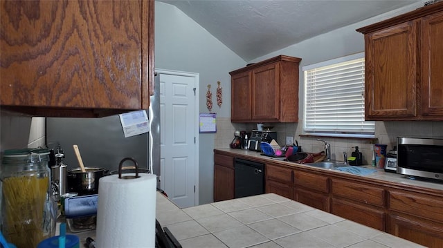 2338 Serenade Dr, Midwest City, OK 73130 - kitchen with tile countertops, dishwasher, vaulted ceiling, decorative backsplash, and a sink