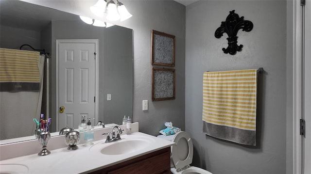 2338 Serenade Dr, Midwest City, OK 73130 - bathroom with double vanity and toilet