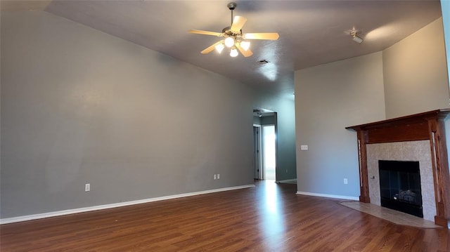 2338 Serenade Dr, Midwest City, OK 73130 - unfurnished living room featuring wood finished floors, ceiling fan, and a fireplace