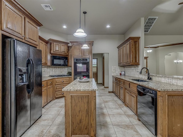 1960 Bermuda Dr, Newcastle, OK 73065 - kitchen with black appliances, a sink, tasteful backsplash, a kitchen island, and brown cabinets