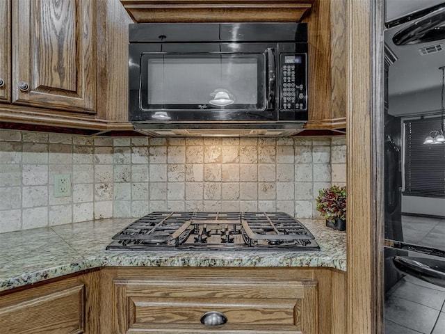 1960 Bermuda Dr, Newcastle, OK 73065 - kitchen featuring black appliances, light countertops, and tasteful backsplash