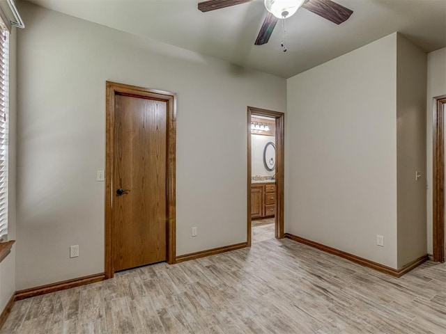 1960 Bermuda Dr, Newcastle, OK 73065 - unfurnished bedroom featuring light wood-type flooring, baseboards, ensuite bathroom, and ceiling fan