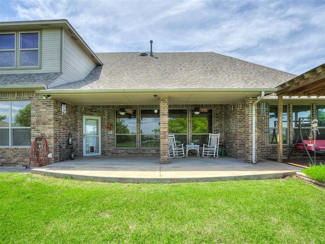 1960 Bermuda Dr, Newcastle, OK 73065 - rear view of property featuring ceiling fan, roof with shingles, a yard, brick siding, and a patio area