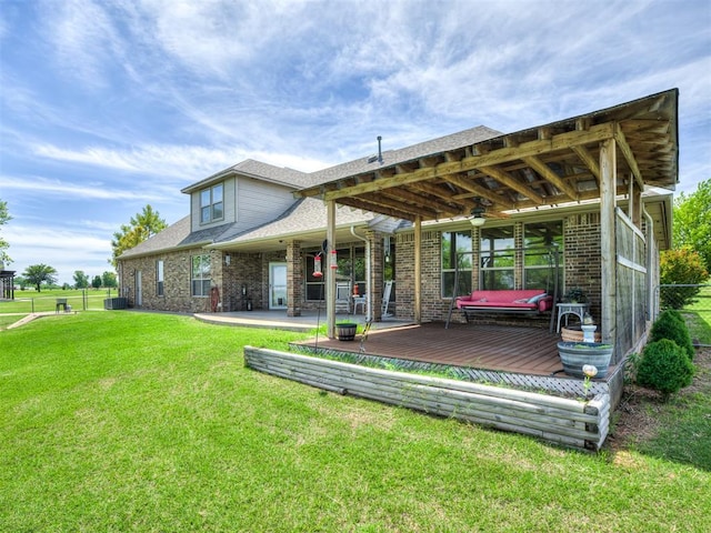 1960 Bermuda Dr, Newcastle, OK 73065 - back of house featuring a deck, a ceiling fan, and brick siding