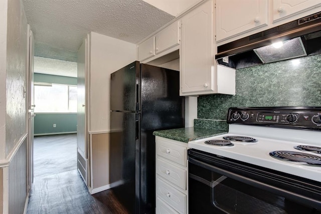 kitchen with range with electric cooktop, under cabinet range hood, freestanding refrigerator, white cabinetry, and tasteful backsplash