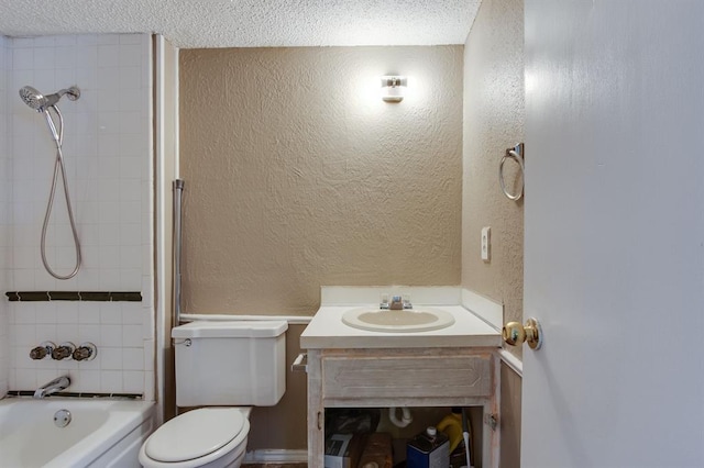 bathroom with vanity, a textured wall, toilet, a textured ceiling, and bathing tub / shower combination