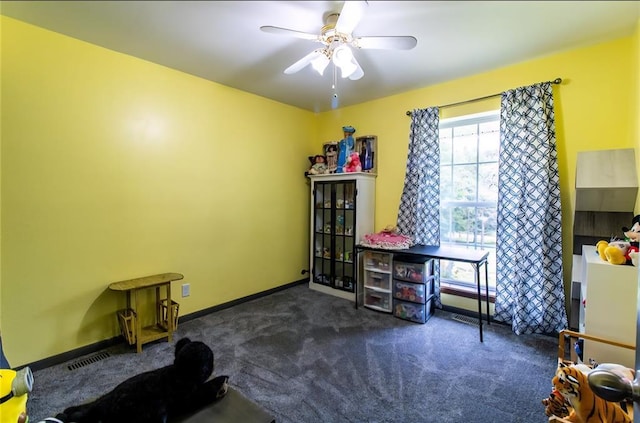 330917 E 940th Rd, Wellston, OK 74881 - miscellaneous room with dark carpet, a ceiling fan, and baseboards