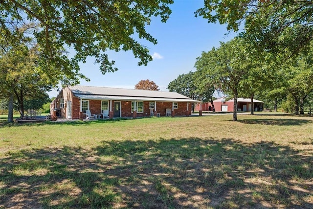 20302 Kings Rd, Shawnee, OK 74801 - ranch-style home with a front lawn and brick siding