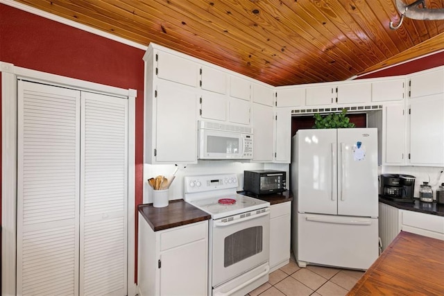 20302 Kings Rd, Shawnee, OK 74801 - kitchen with white appliances, wooden ceiling, dark countertops, light tile patterned flooring, and white cabinets