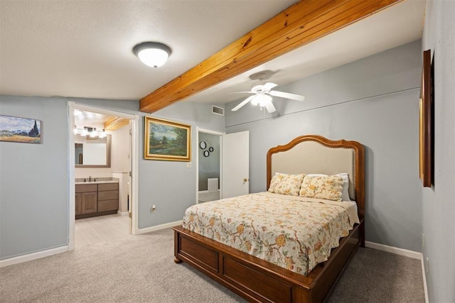 20302 Kings Rd, Shawnee, OK 74801 - bedroom with light carpet, baseboards, a sink, beamed ceiling, and ensuite bathroom